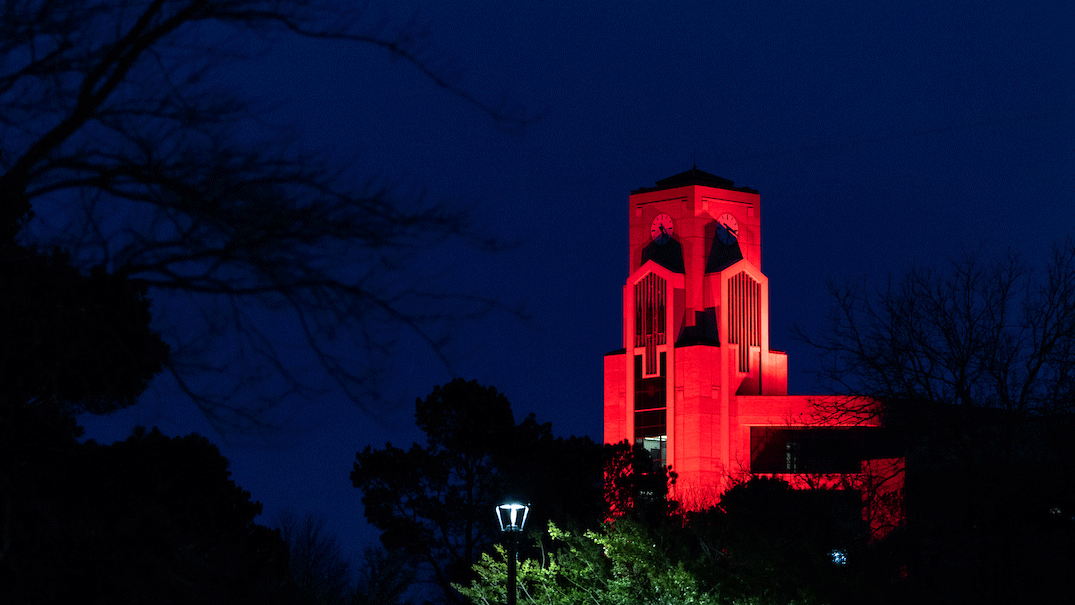 Photo of Ellis Library Tower lighted scarlet